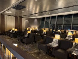 a room with chairs and lamps