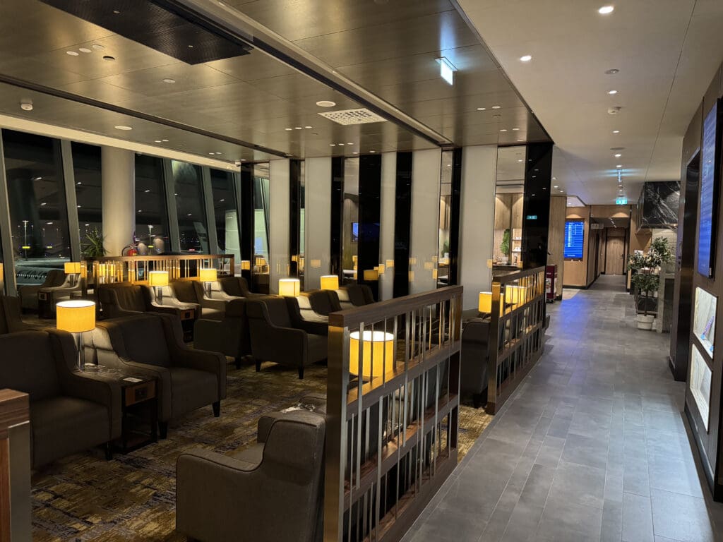 a room with chairs and a large window