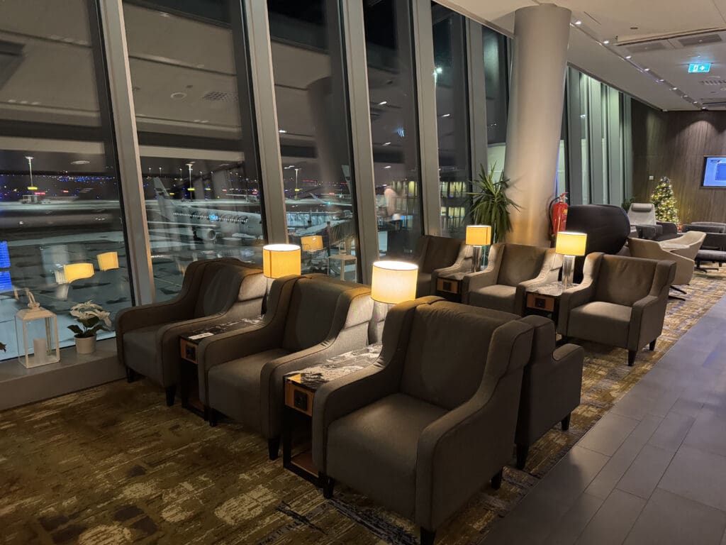 a room with chairs and lamps