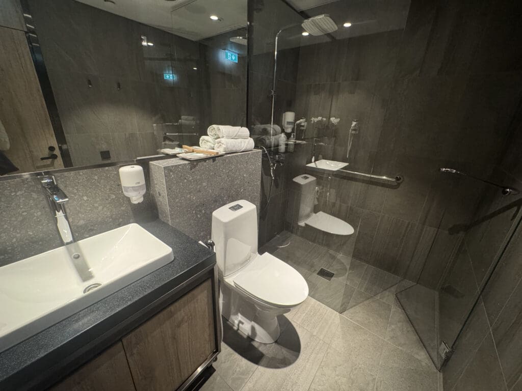 a bathroom with a glass shower door