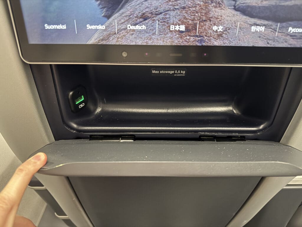 a hand holding a screen