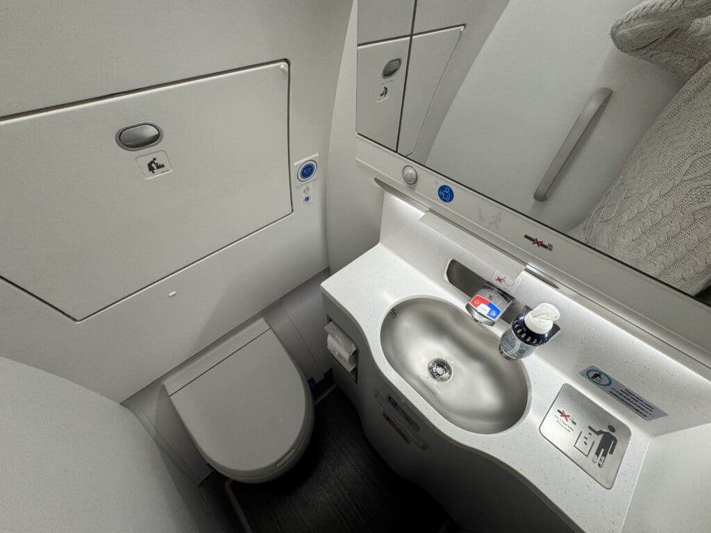 a bathroom with a sink and mirror