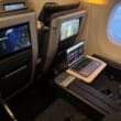 a laptop on a table in an airplane