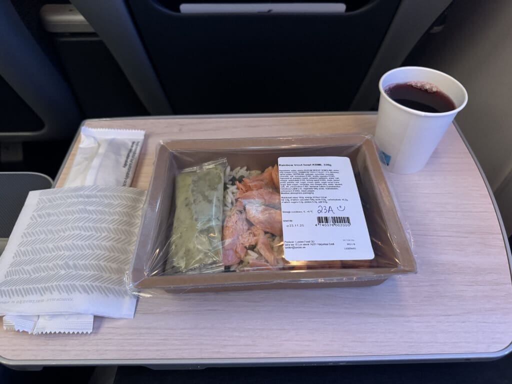 a tray of food and a drink on a table