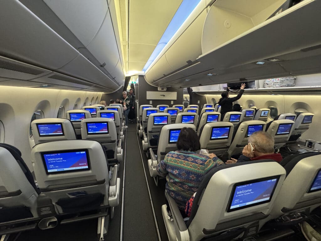 a group of people sitting in an airplane