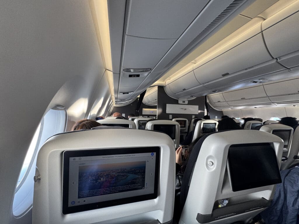 a group of people sitting in an airplane