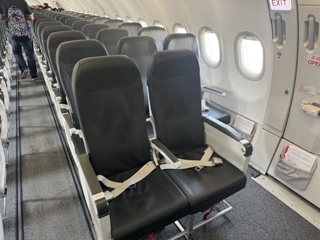 seats in an airplane with windows