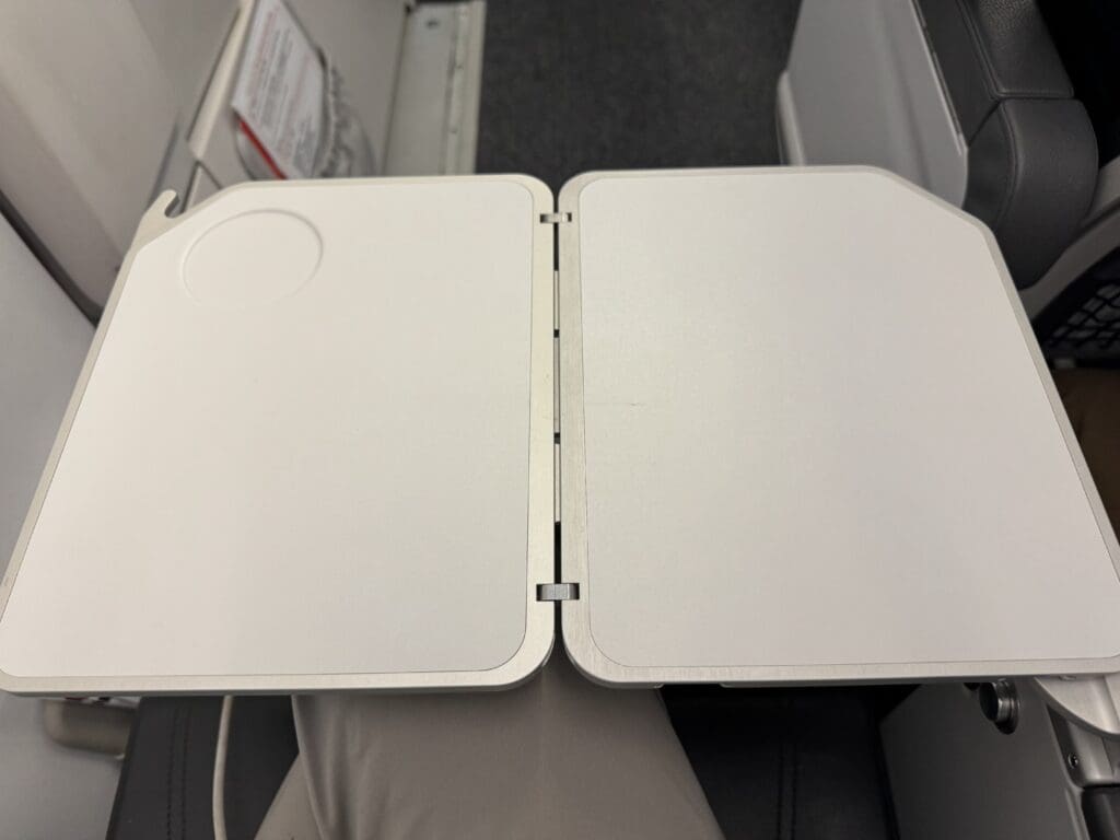 a white plastic container on a person's arm