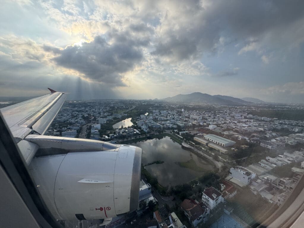 an airplane wing and a city