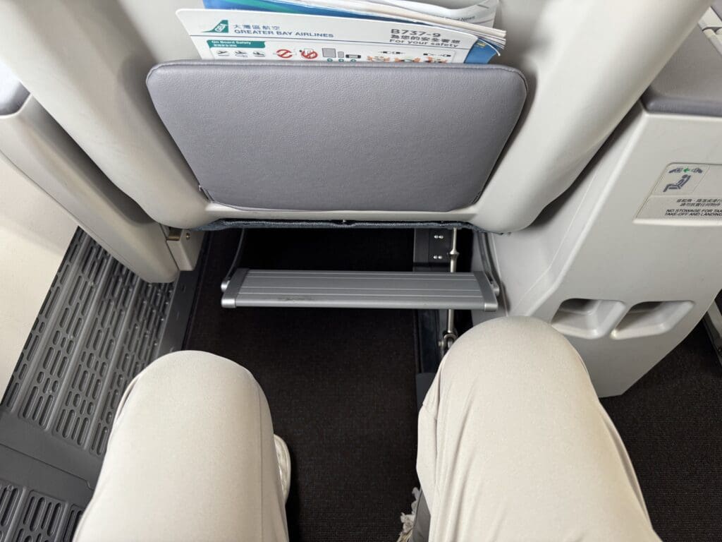 a person's legs and legs in a seat