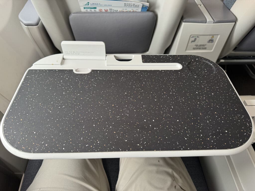 a black and white tray on a person's lap