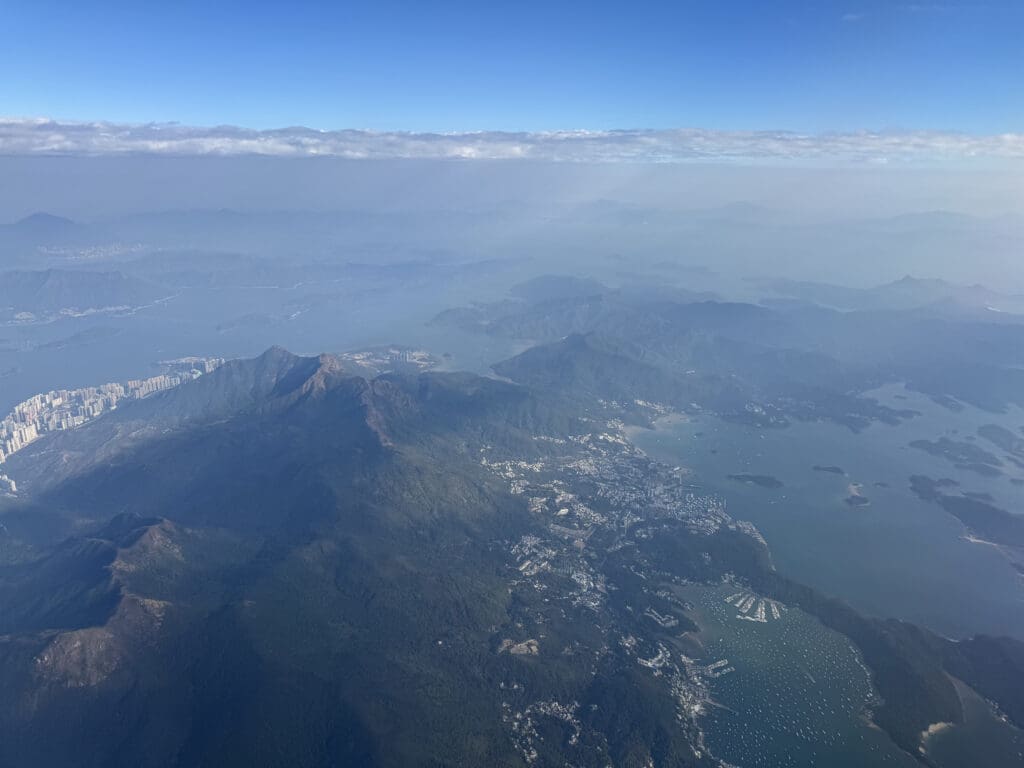 aerial view of a mountain range and water