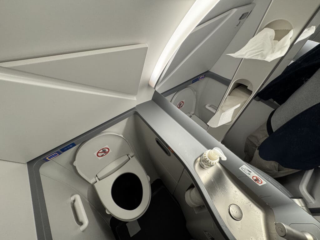 a toilet and sink in a plane