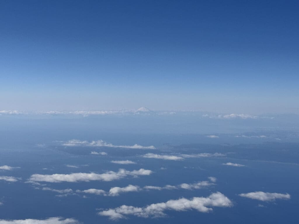 clouds and a mountain in the distance