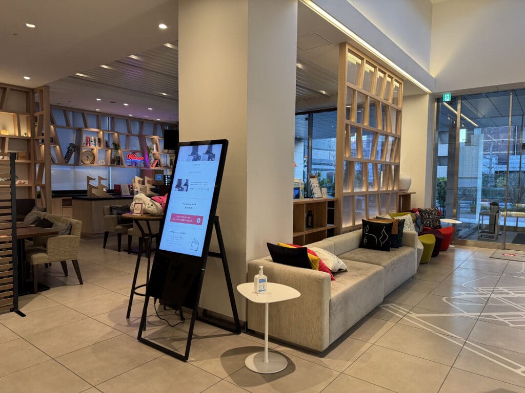 a room with a large screen and a couch