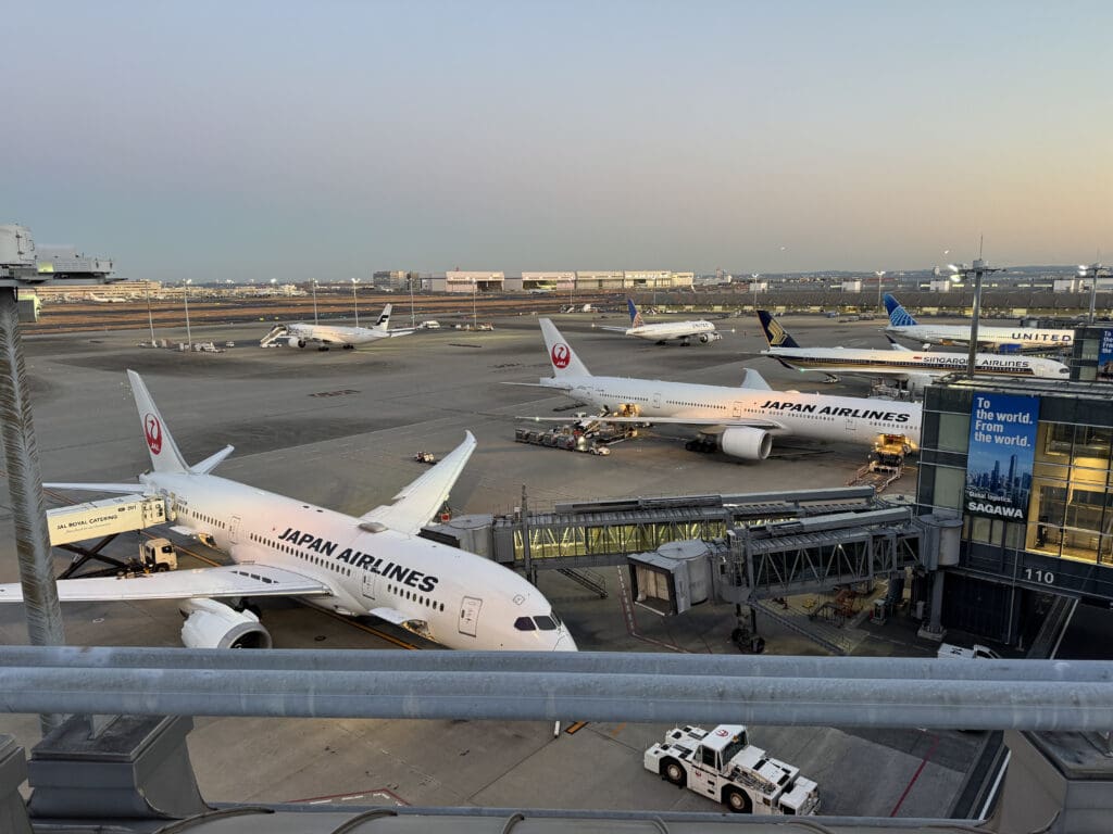 a group of airplanes at an airport