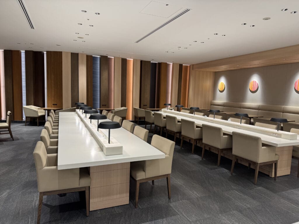 a room with a long table and chairs