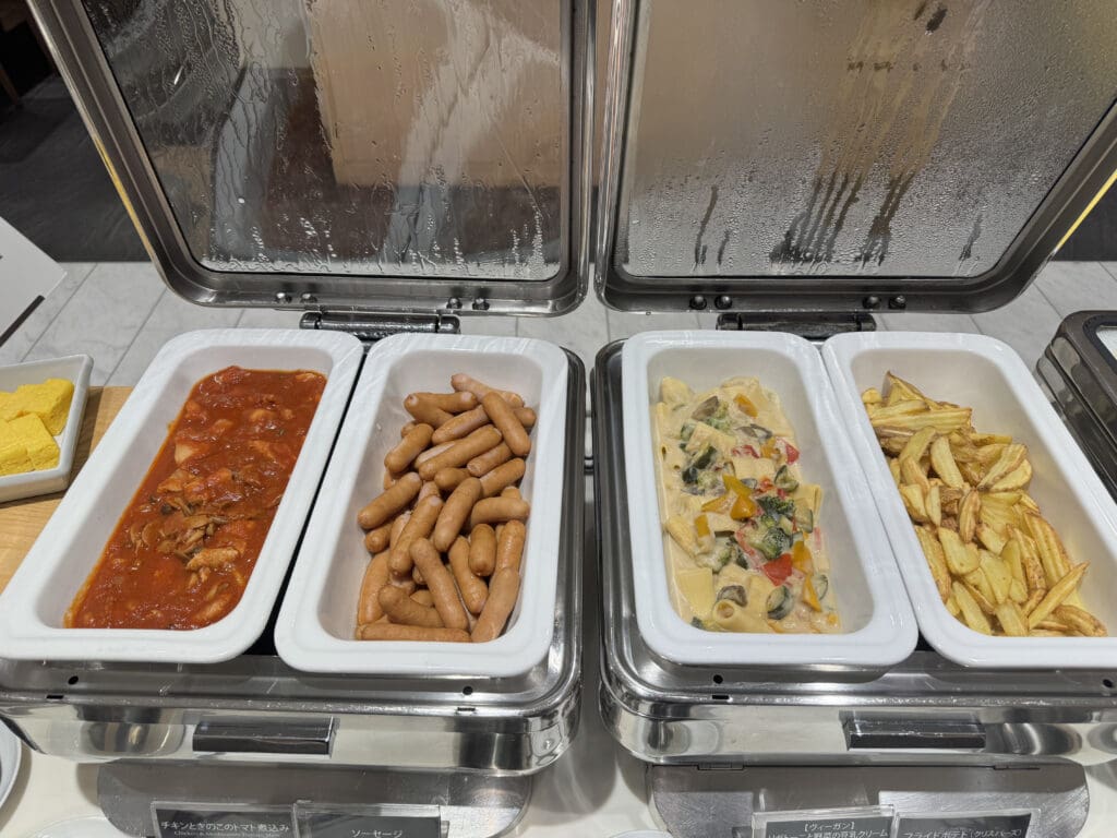 a trays of food in a buffet
