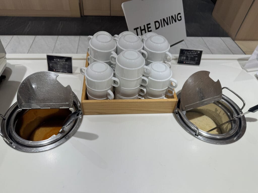 a group of white cups on a counter