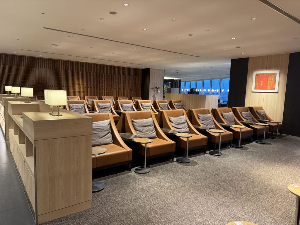 a room with brown chairs and a podium