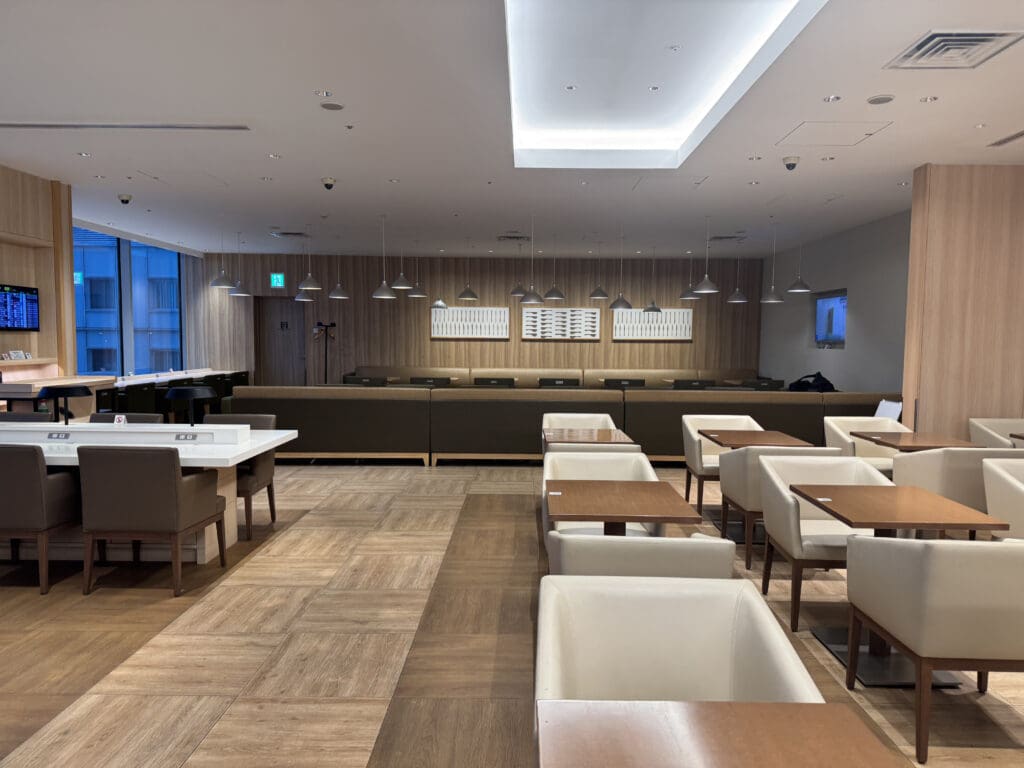 a room with white tables and chairs