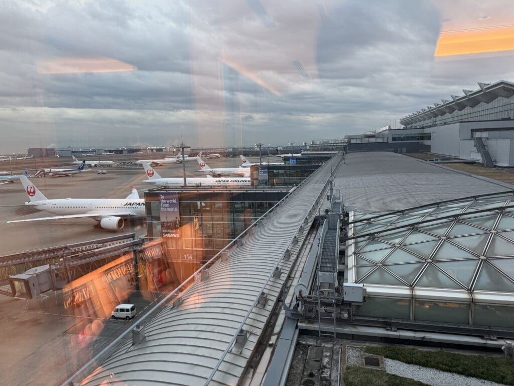 a group of airplanes at an airport