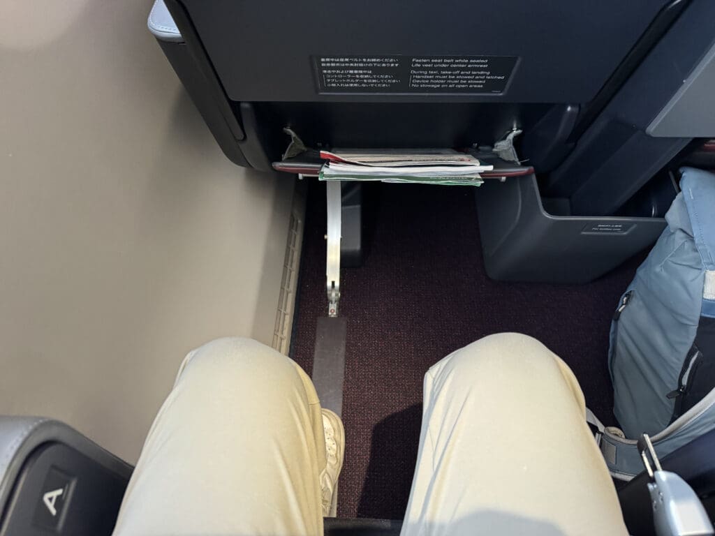 a person's legs in a seat