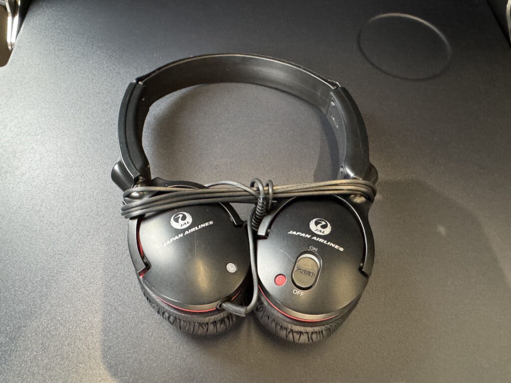 a pair of black headphones with a cord attached to it