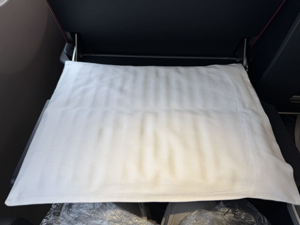 a white pillow on a chair
