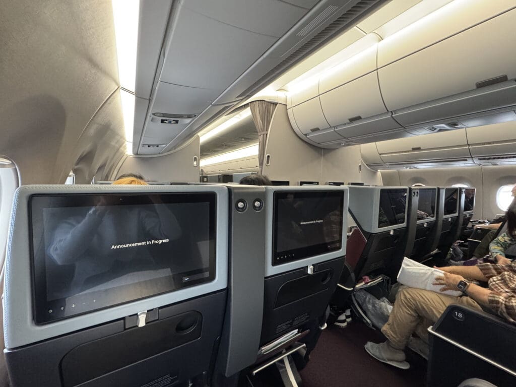 a group of people sitting in an airplane