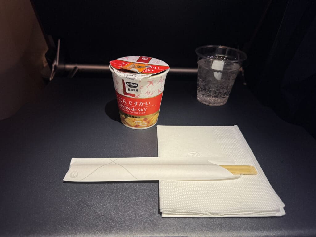 a cup and napkins on a table