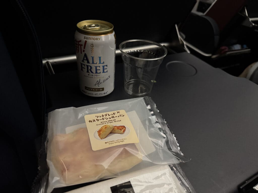 a can of water and food on a table