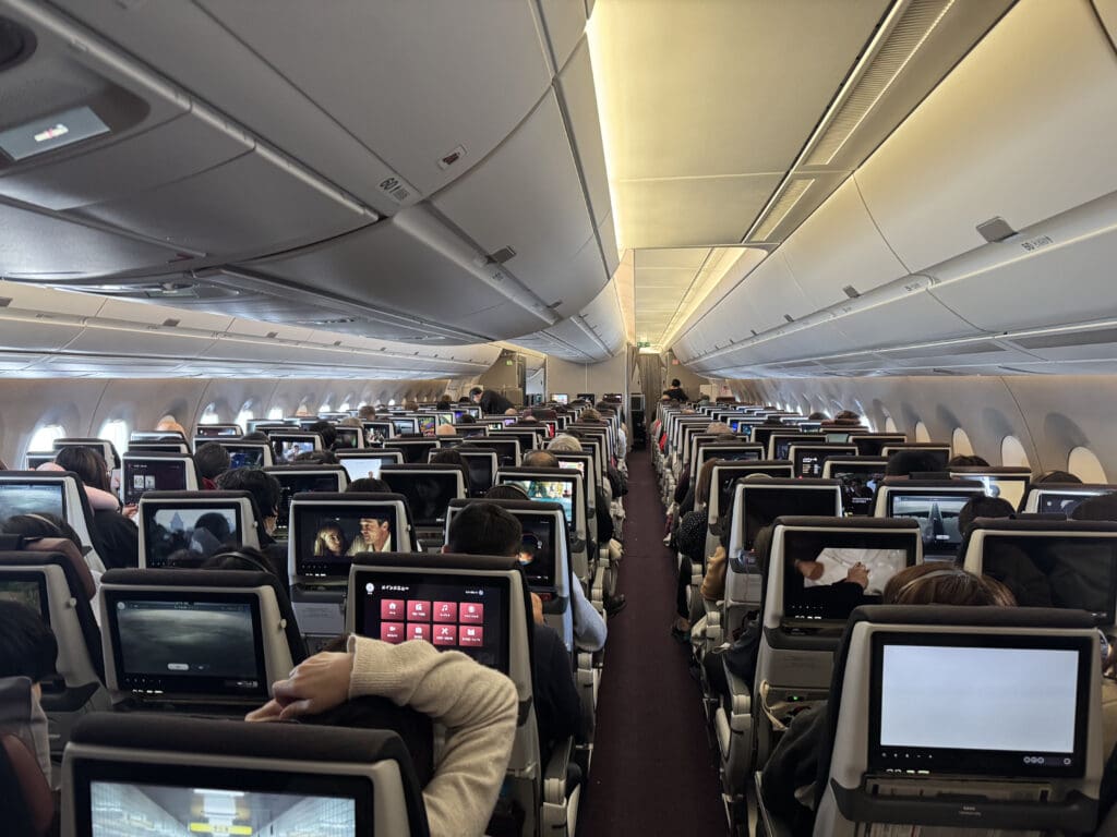 a group of people sitting in an airplane