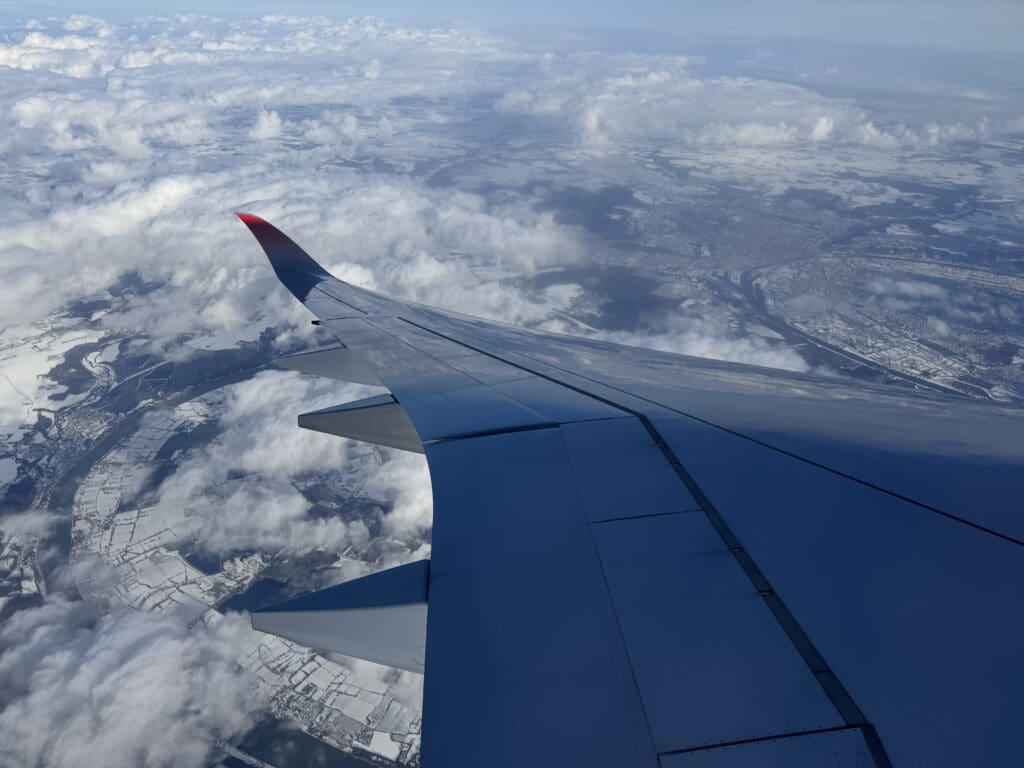 an airplane wing in the sky