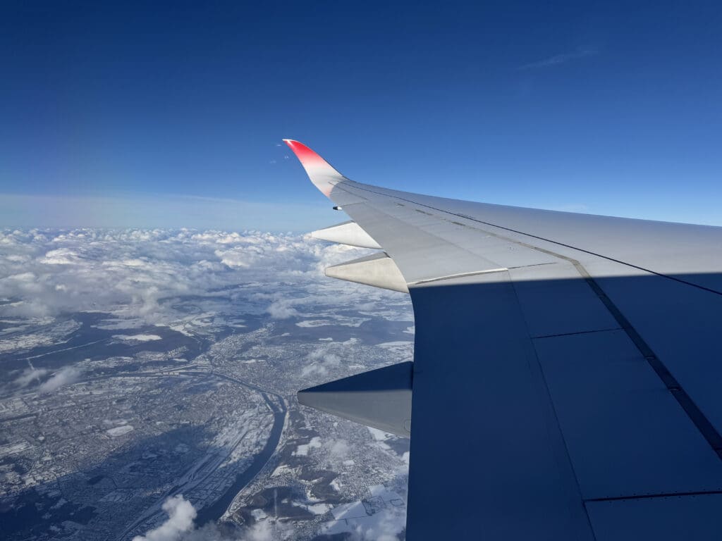 an airplane wing in the sky