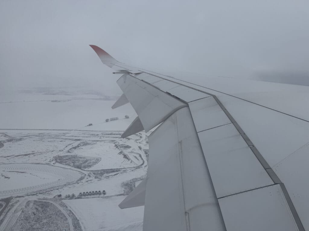 an airplane wing in the sky