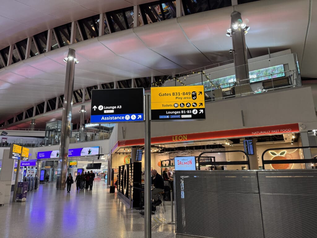 a group of people walking in a terminal