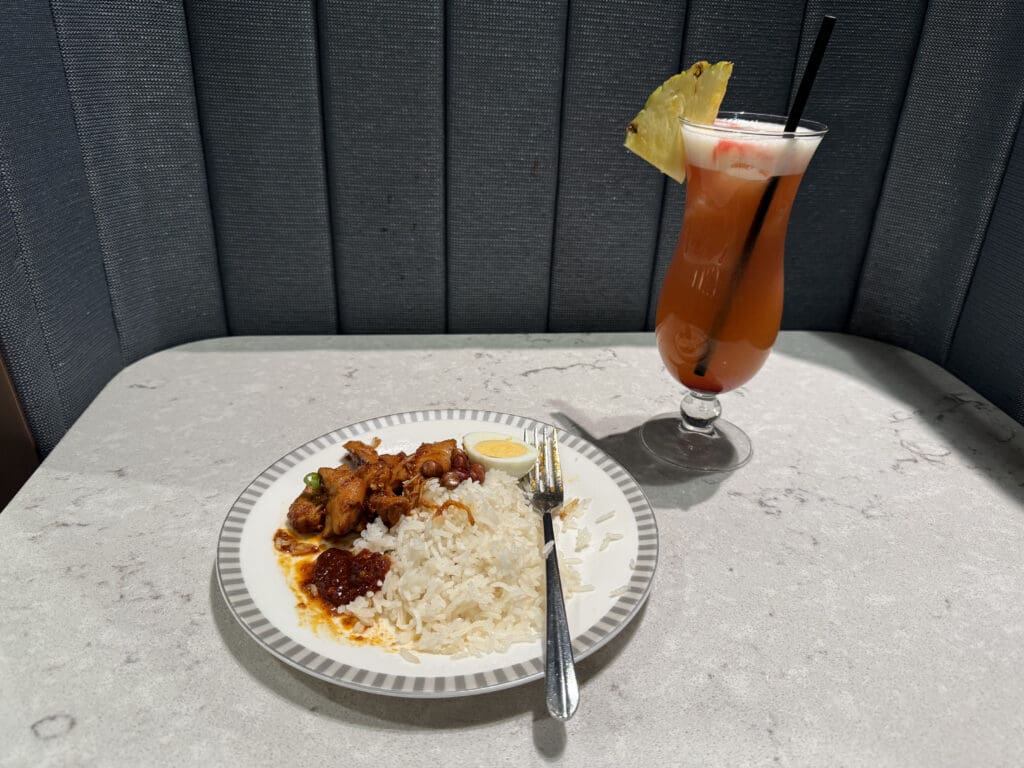 a plate of food and a drink on a table
