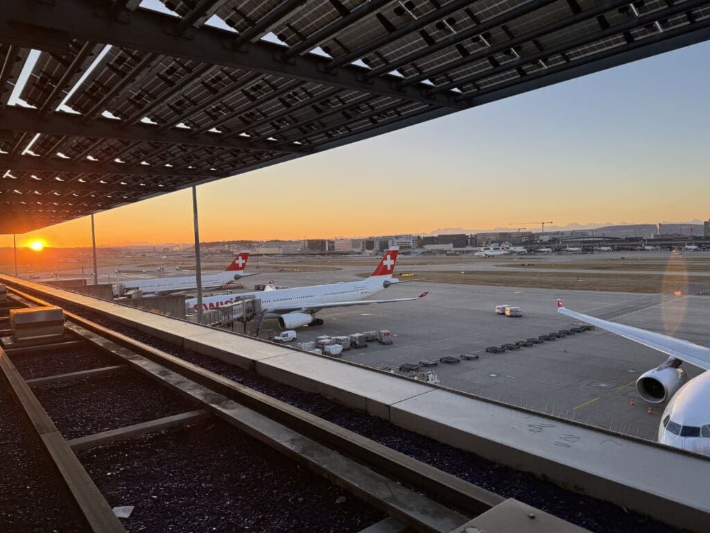 a group of airplanes at an airport