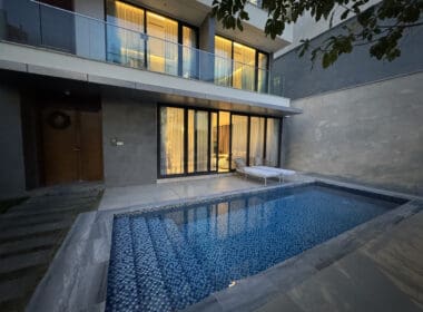 a pool in front of a building