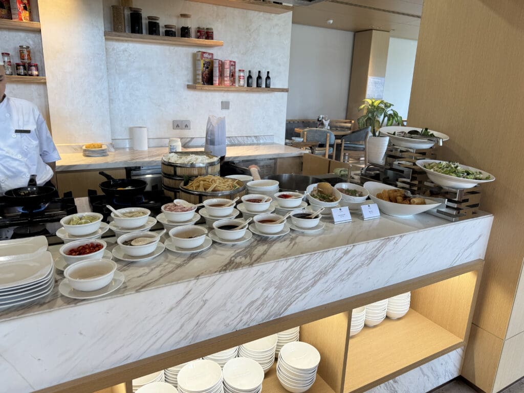 a buffet table with bowls of food