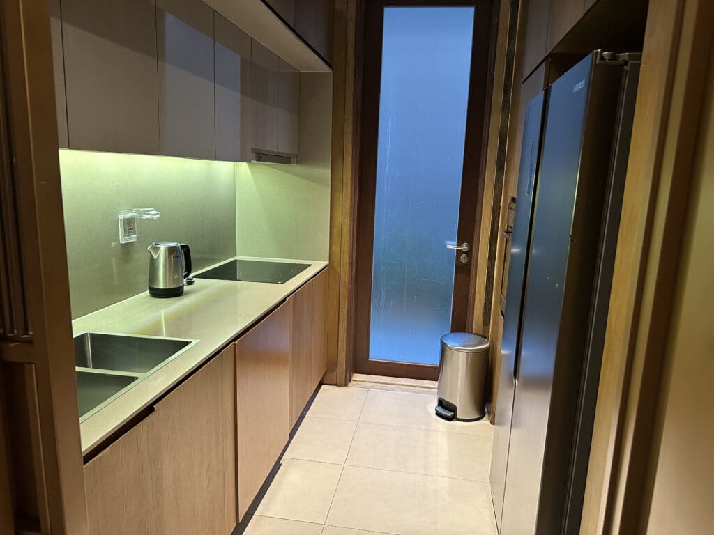 a kitchen with a sink and refrigerator