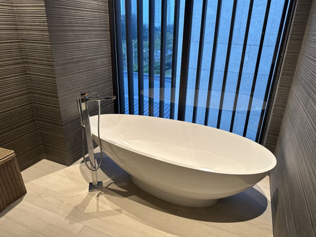 a white bathtub in a bathroom