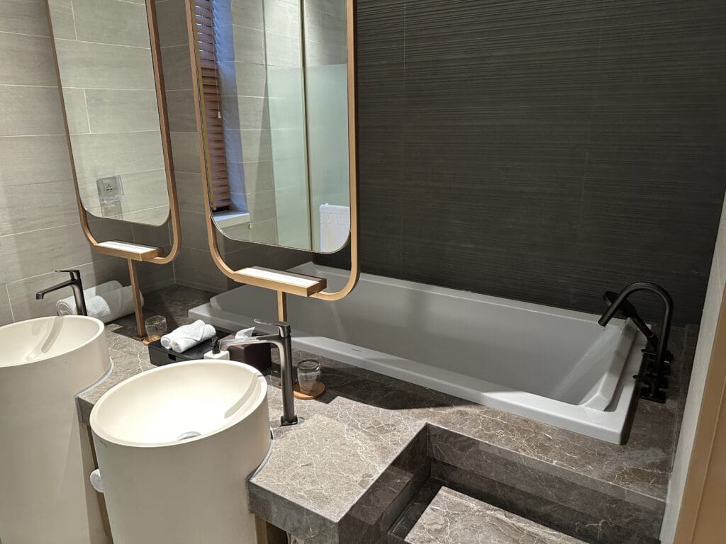 a bathroom with a tub and sink