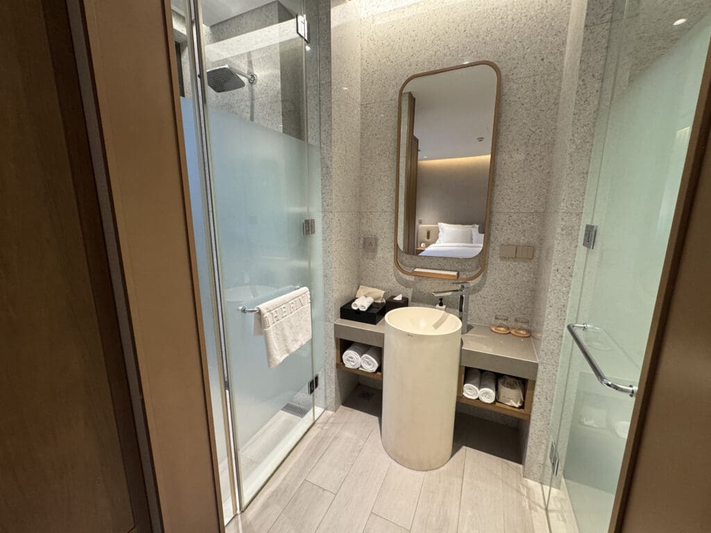 a bathroom with a mirror and sink