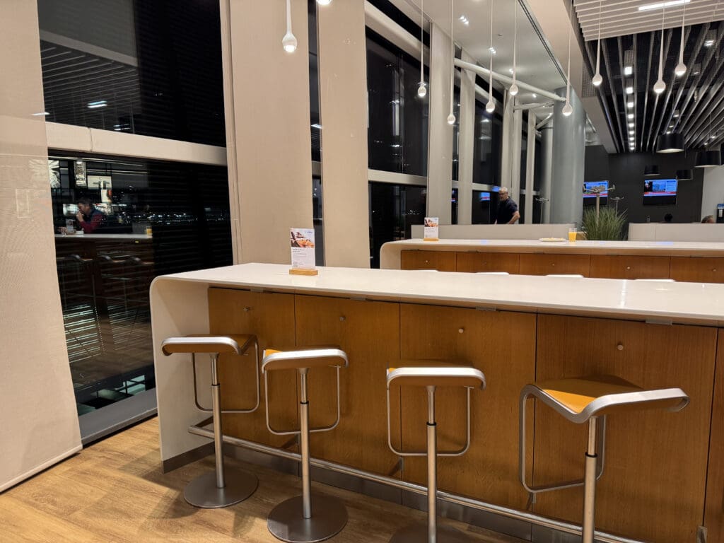 a bar with stools in a room