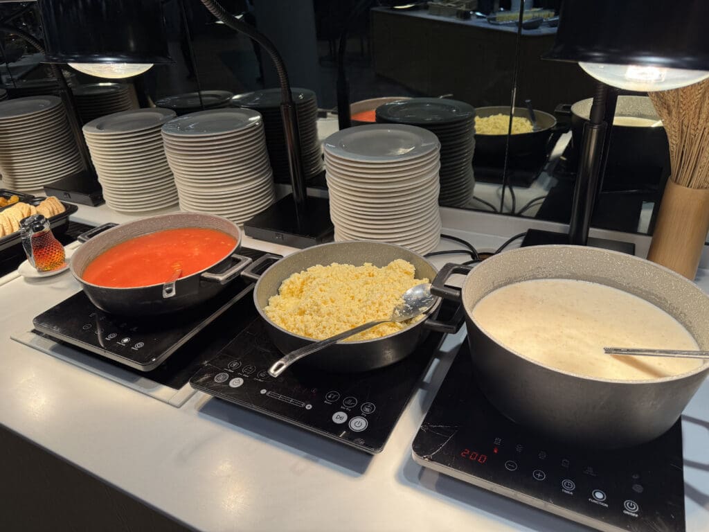 a group of pots with food in them