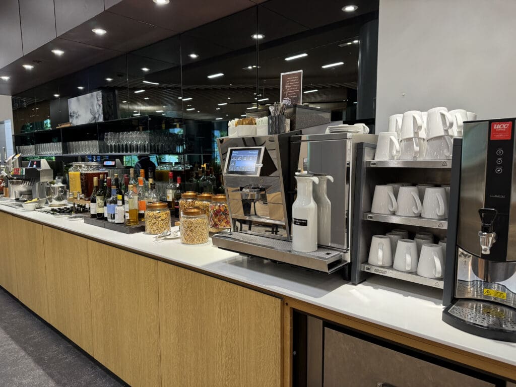 a coffee machine and coffee cups on a counter