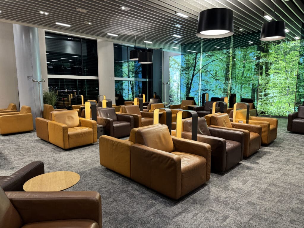 a room with many chairs and a large window