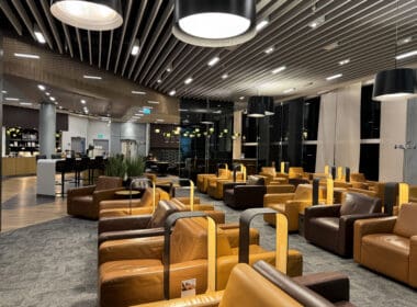 a room with brown leather chairs and a black ceiling